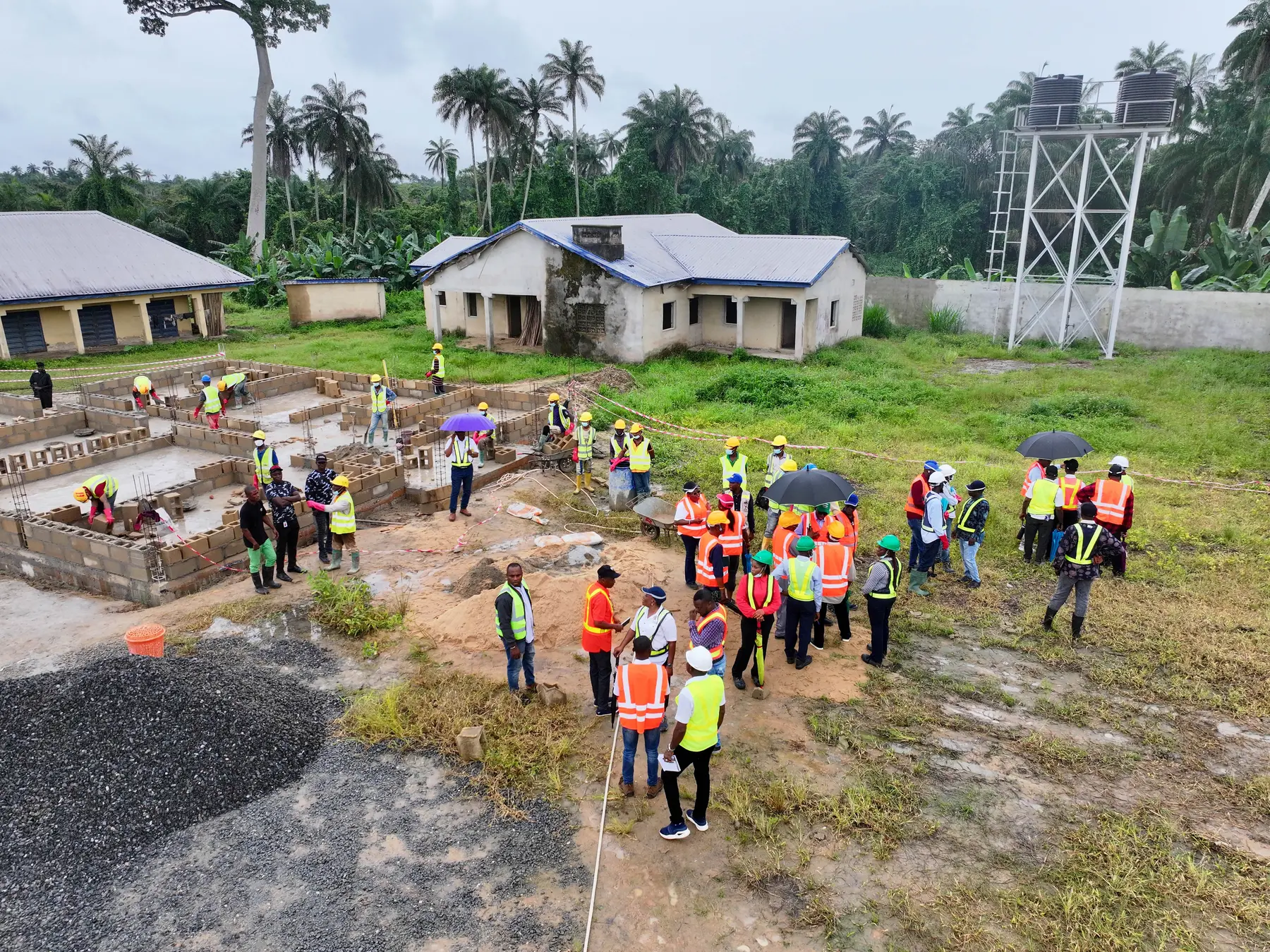 Construction personnel working together on an active infrastructure site